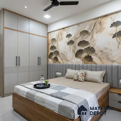 Modern bedroom with beige floral wallpaper, grey upholstered headboard, and light grey wardrobe with wood accents