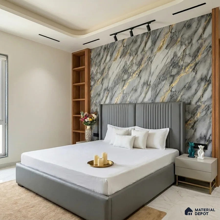 Modern bedroom with grey and gold marble accent wall and upholstered bed