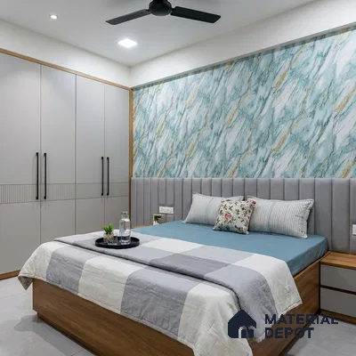 Modern bedroom with blue marble-look wallpaper, grey upholstered headboard, and matte beige wardrobe