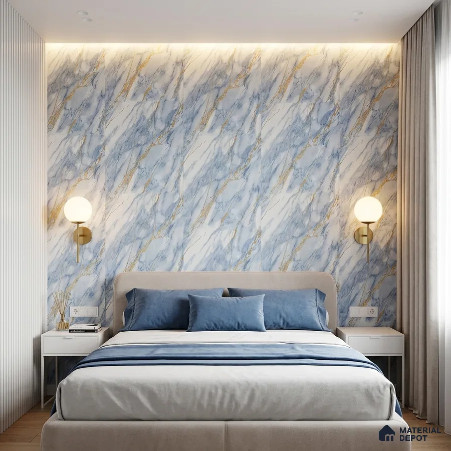 Modern bedroom with blue and gold marble-look accent wall and upholstered bed