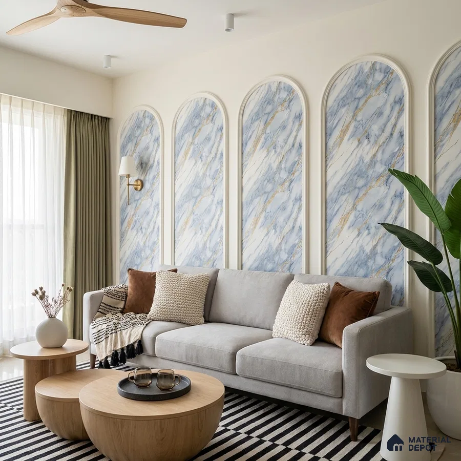 Modern living room with blue and gold marble-look wall panels and light wood coffee tables