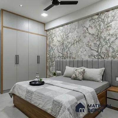 Modern bedroom with floral wallpaper, grey suede upholstered headboard, and matte grey wardrobe laminate