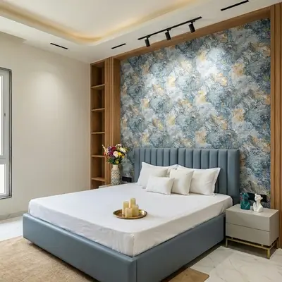 Modern bedroom with blue abstract wallpaper, suede upholstered bed, and wood laminate shelving