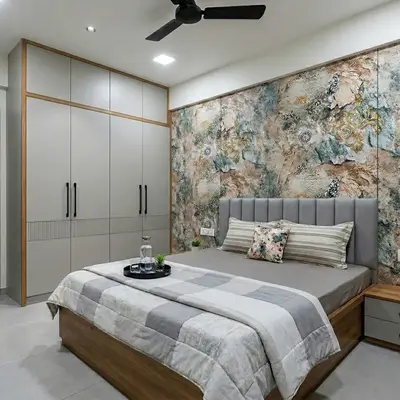 Modern bedroom with abstract wallpaper accent wall and matte grey wardrobe laminate