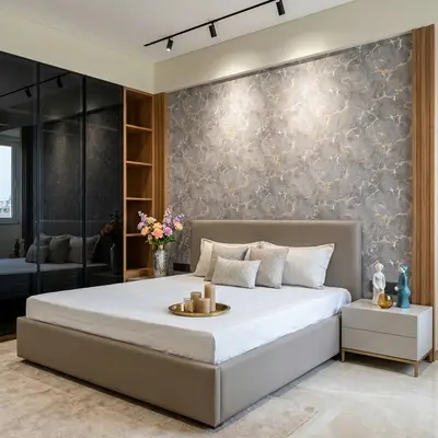Modern bedroom with marble-look wallpaper, taupe upholstered bed, and glass wardrobe shutters
