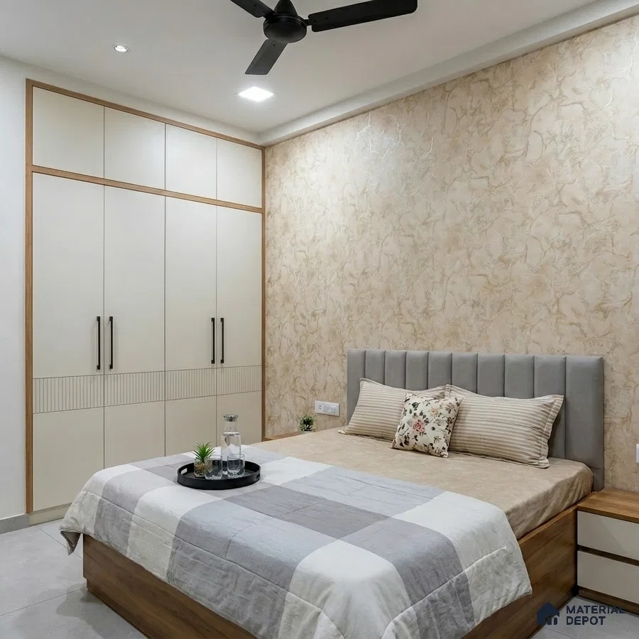 Modern bedroom with beige marble textured wallpaper, frosty white wardrobe, and grey suede upholstered bed