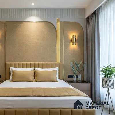Modern bedroom with beige suede upholstered bed, textured beige wall panels, and gold accent lighting