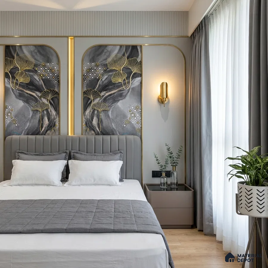 Art Deco bedroom with gold-accented abstract wallpaper, grey upholstered bed, and light wood flooring